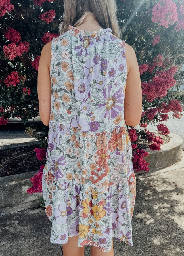 back of Floral ruffle mini dress with pickets and front tie detail